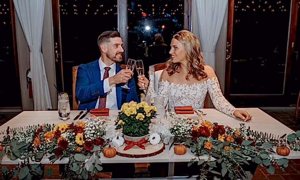Bride and groom cheersing during their Ballyowen Bailigh Bluff House wedding reception.