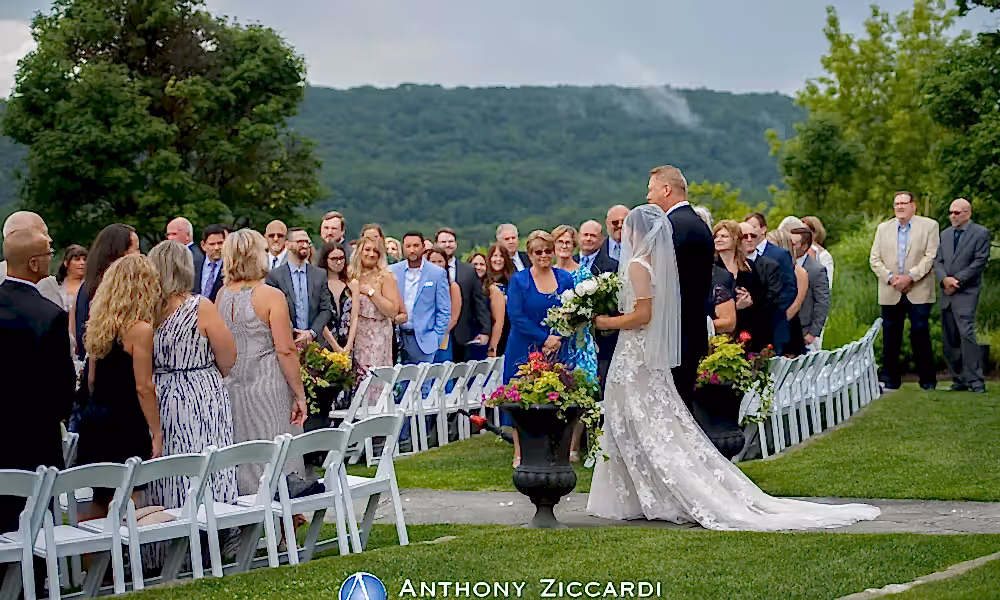 Bride walking down the aisle at Wedding Garden ceremony space at Crystal Springs Country Club. 