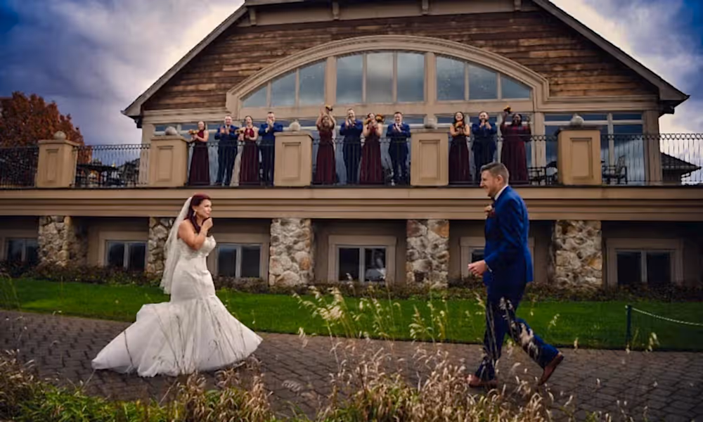 Wedding couple first reveal with wedding party watching from the Ballyowen balcony