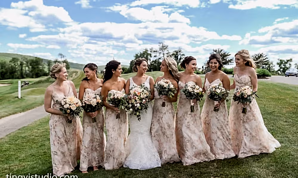 Bridesmaids wearing light pink dresses with Bride