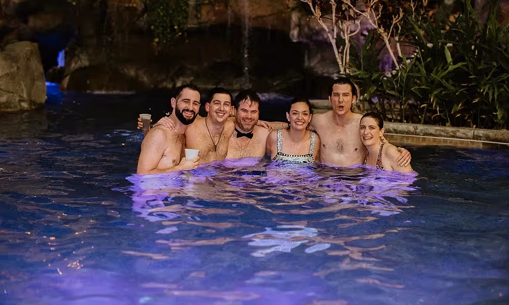 Wedding party in pool at Biosphere