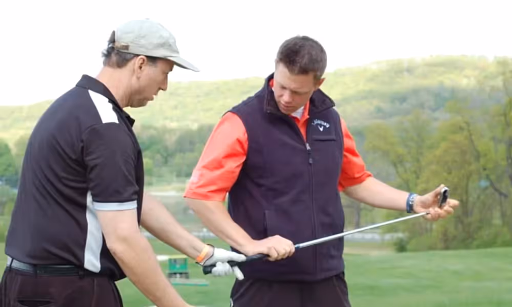 Golf Instructor teaching man to golf at Crystal Springs Resort