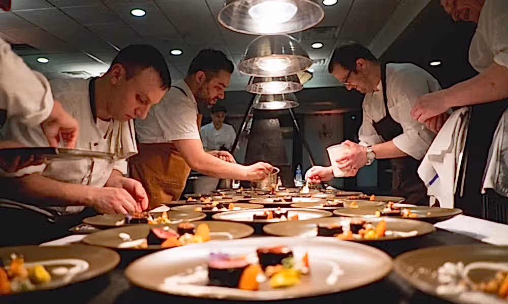 Chefs hard at work plating food at NJ Wine and Food Festival
