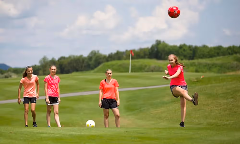 Four girls playing foot golf at a resort close to New York City