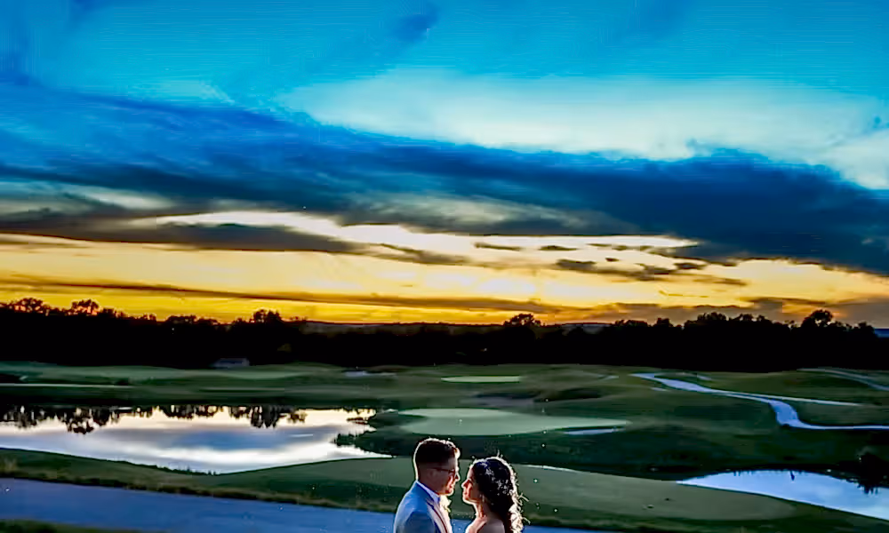 Bride and groom on Ballyowen Golf Course at sunset