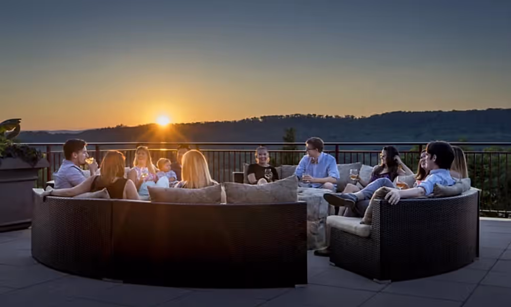 Corporate group around firepit on Fire and water terrace