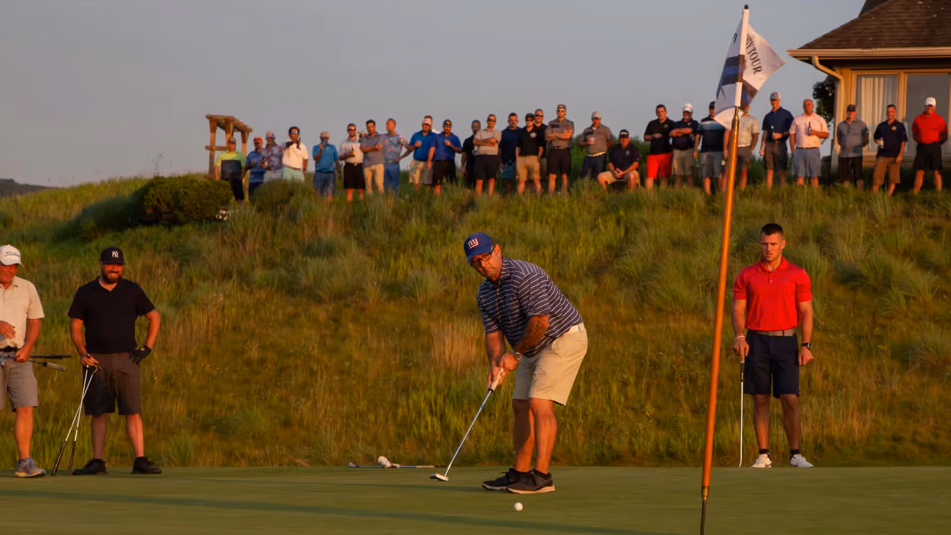 Spectators at the 2021 Law Enforcement Open watching golfer