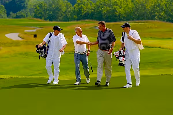 Golfers and Caddies at a golf resort close to New York City