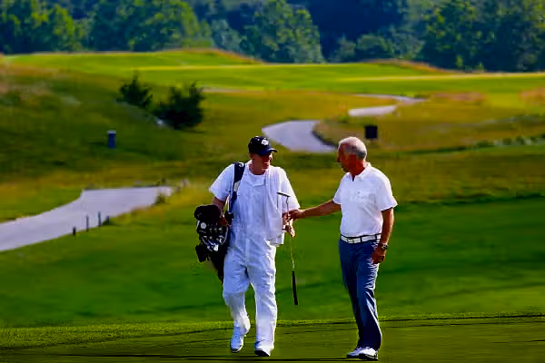 Golfer and Caddy on the course of Ballyowen at Crystal Springs Resort