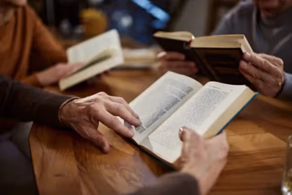 Person holding a book.