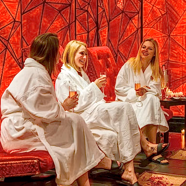 Group of women drinking champagne in Reflections Spa. 
