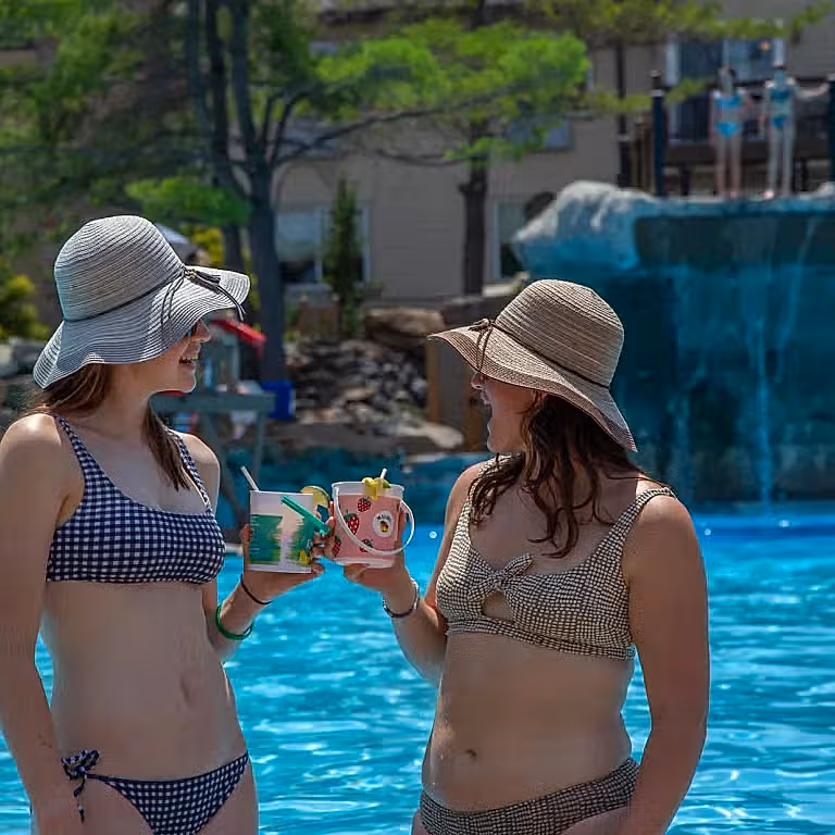 Girlfriends enjoying rum buckets at Minerals Pool