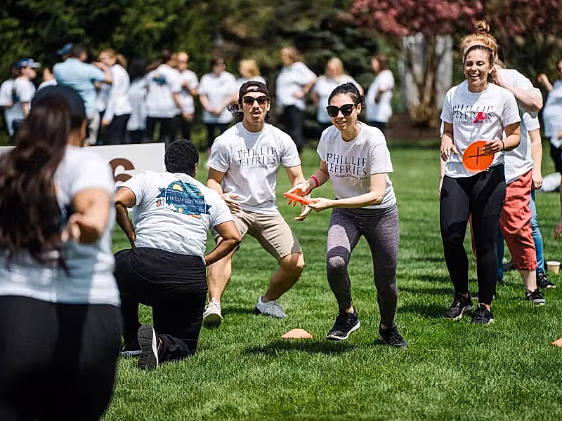 Group playing frisbee during teambuilding exercise.