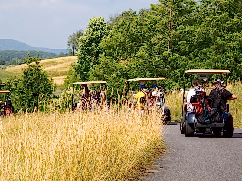 Golf carts driving to their next hole at Cascades Golf Course at Crystal Springs Resort