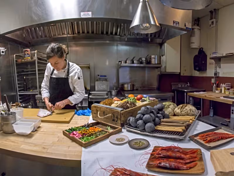 Chef Aishling preparing food in the kitchen.